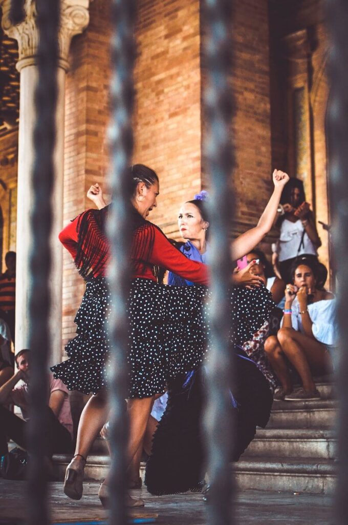 two women dancing outdoors